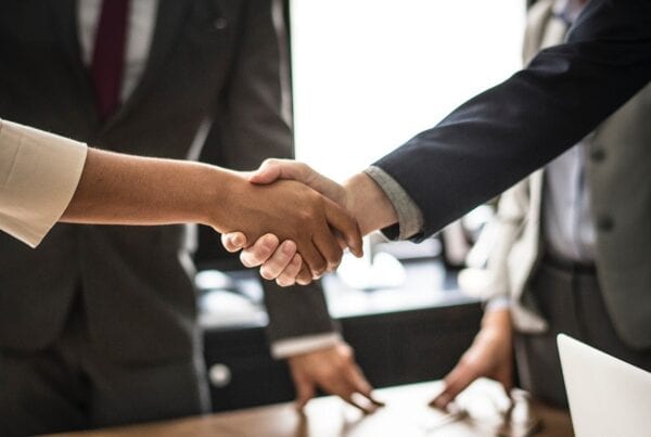 Man and woman sharing a handshake