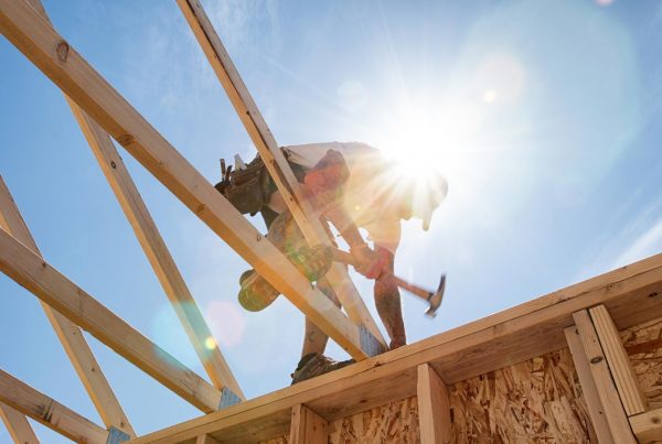 Builder working on house