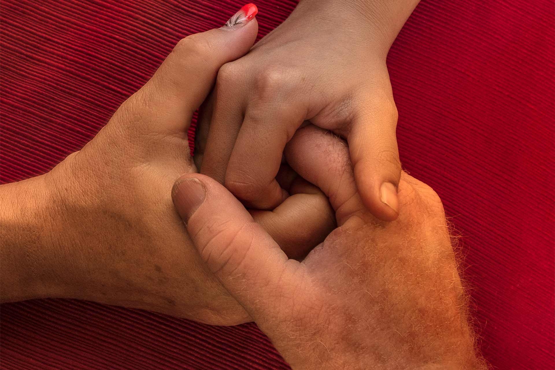 3 hands holding