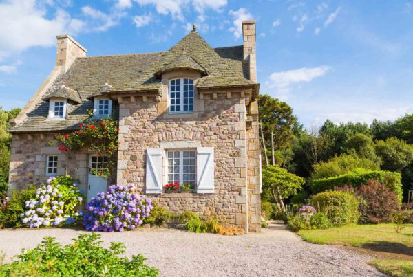 Small old brick English cottage in countryside