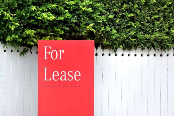 Red for Lease sign outside fence